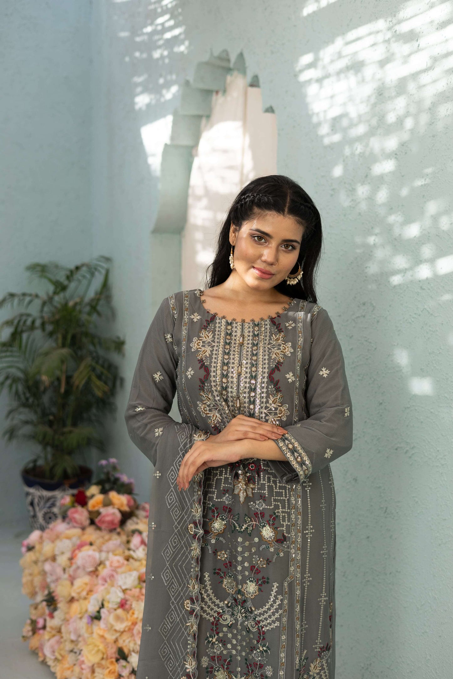 Woman in a gray embroidered chiffon shalwar kameez front pic