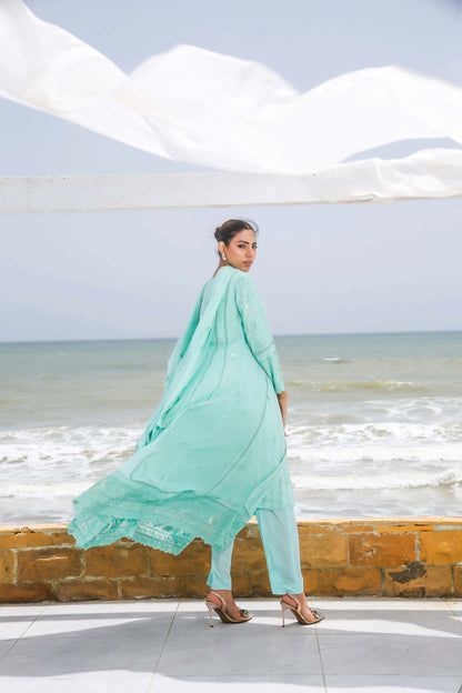Back profile of model in blue formal gown dress