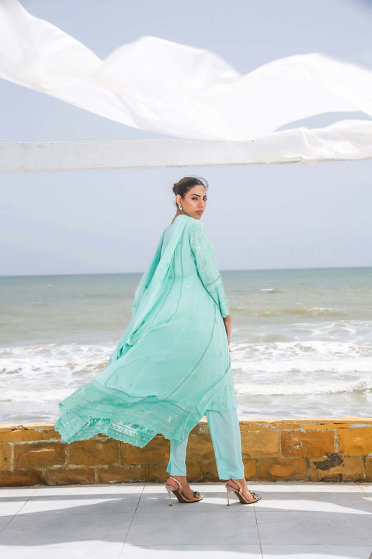 Back profile of model in blue formal gown dress