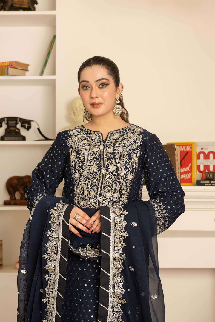 Handwork and embroidery detail on navy blue lehenga border and kameez