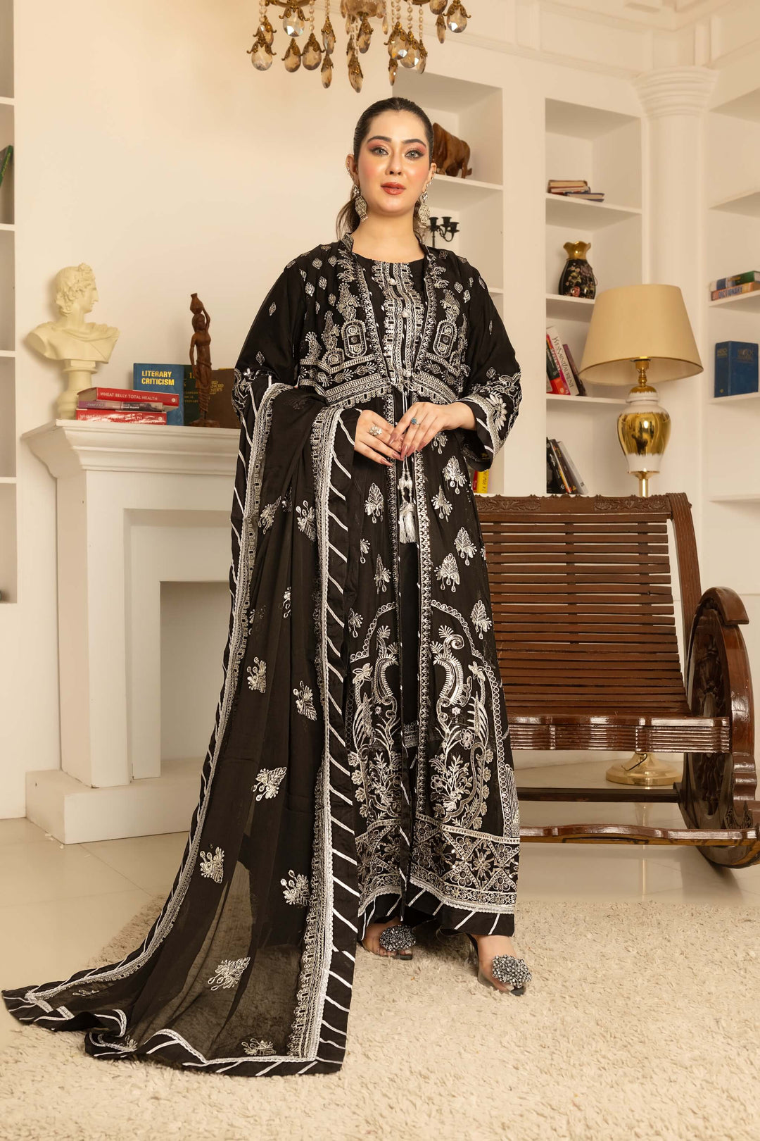 Front view of women styling black chiffon Anarkali coat front open suit