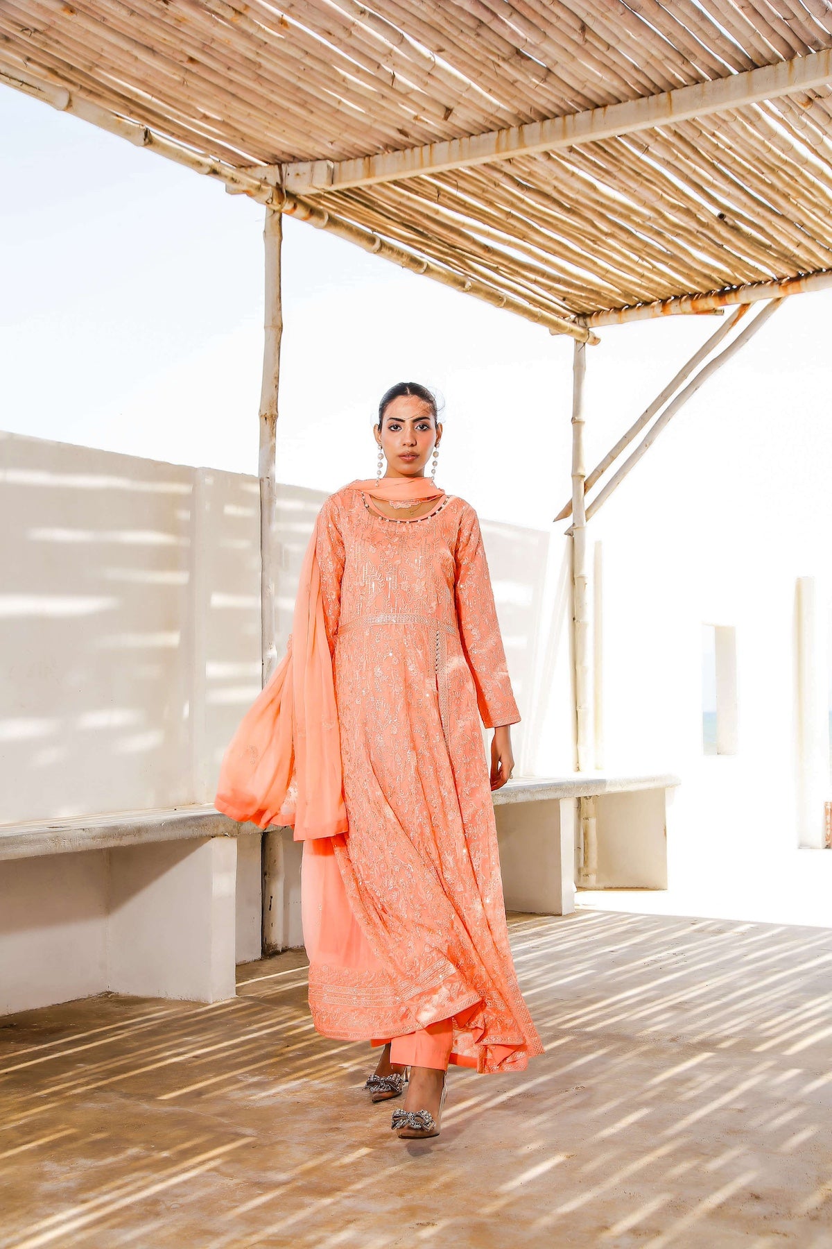 Front view of melon embroidered Anarkali frock