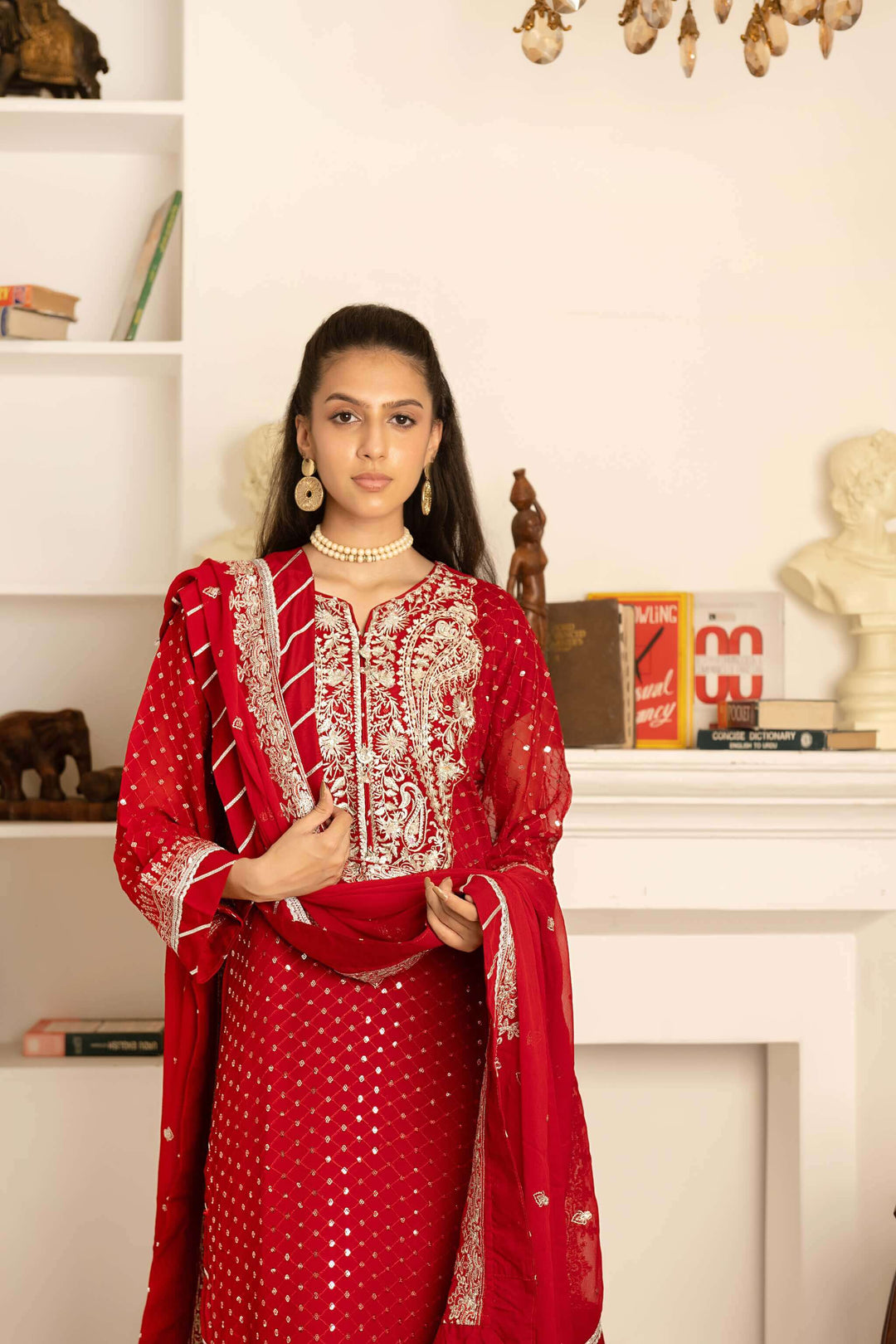 Embroidery detail on kameez and lehenga border of red wedding lehenga