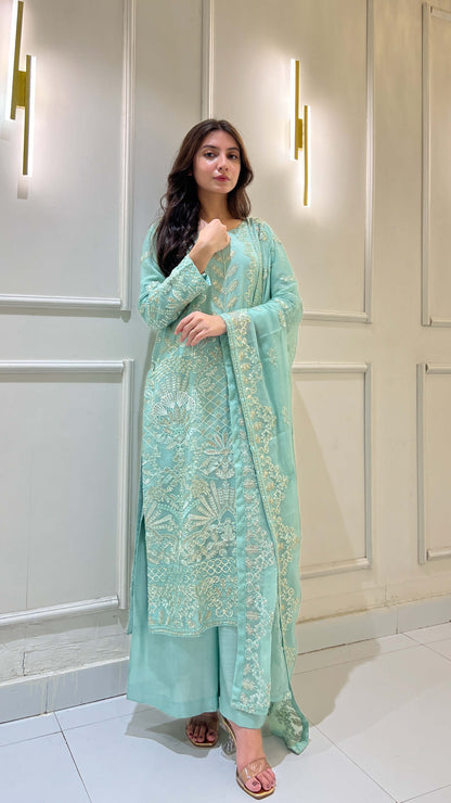 Model styling light blue chiffon embroidered suit with matching dupatta