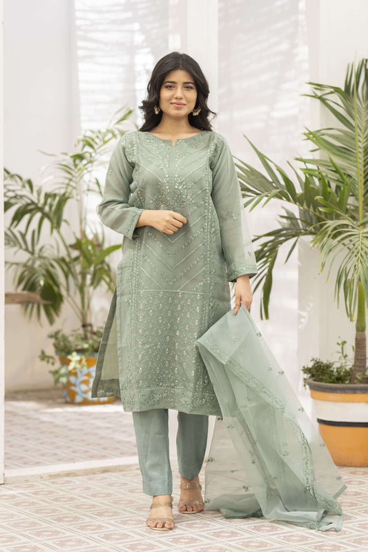 Woman wearing a light green traditional outfit