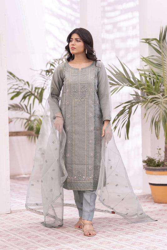 Woman wearing a light green traditional outfit with a light dupatta