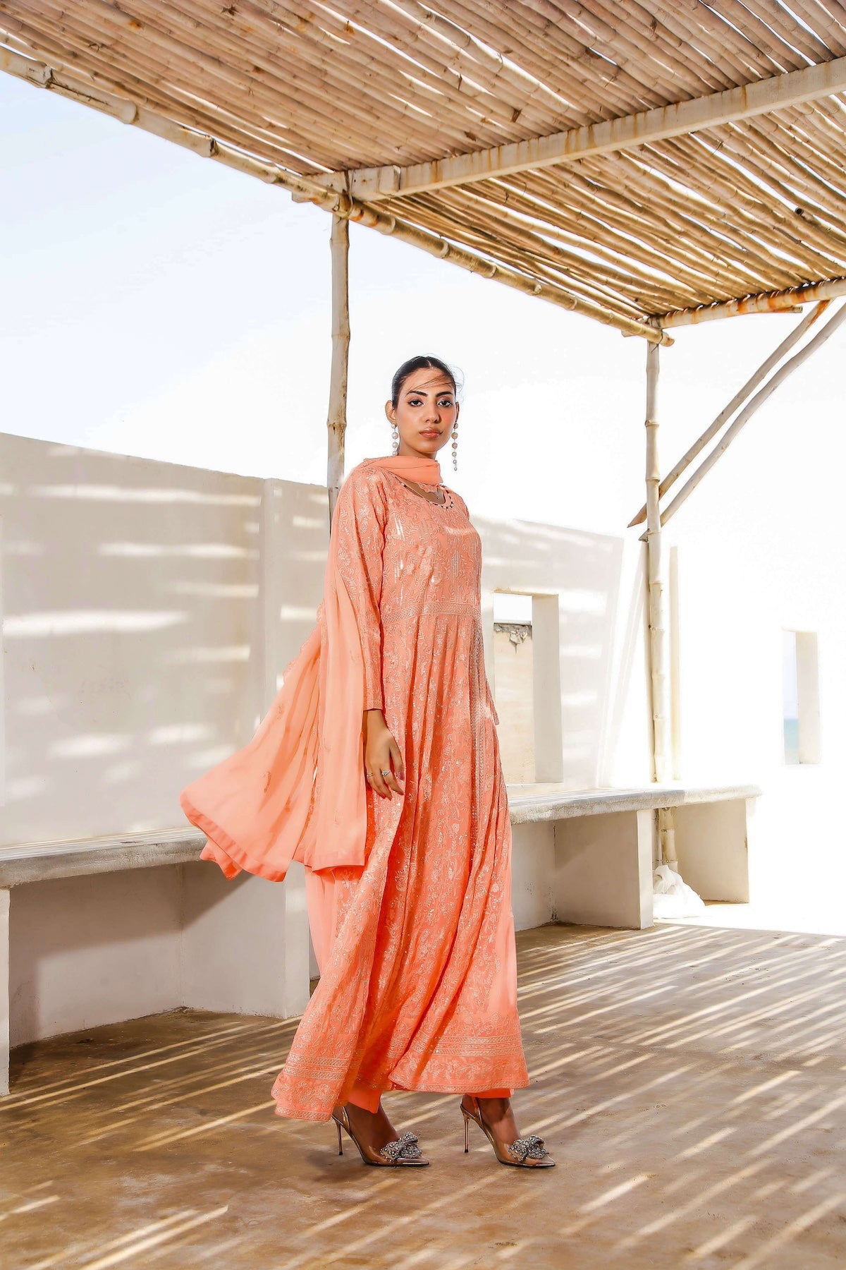 Side view of flared melon gown maxi