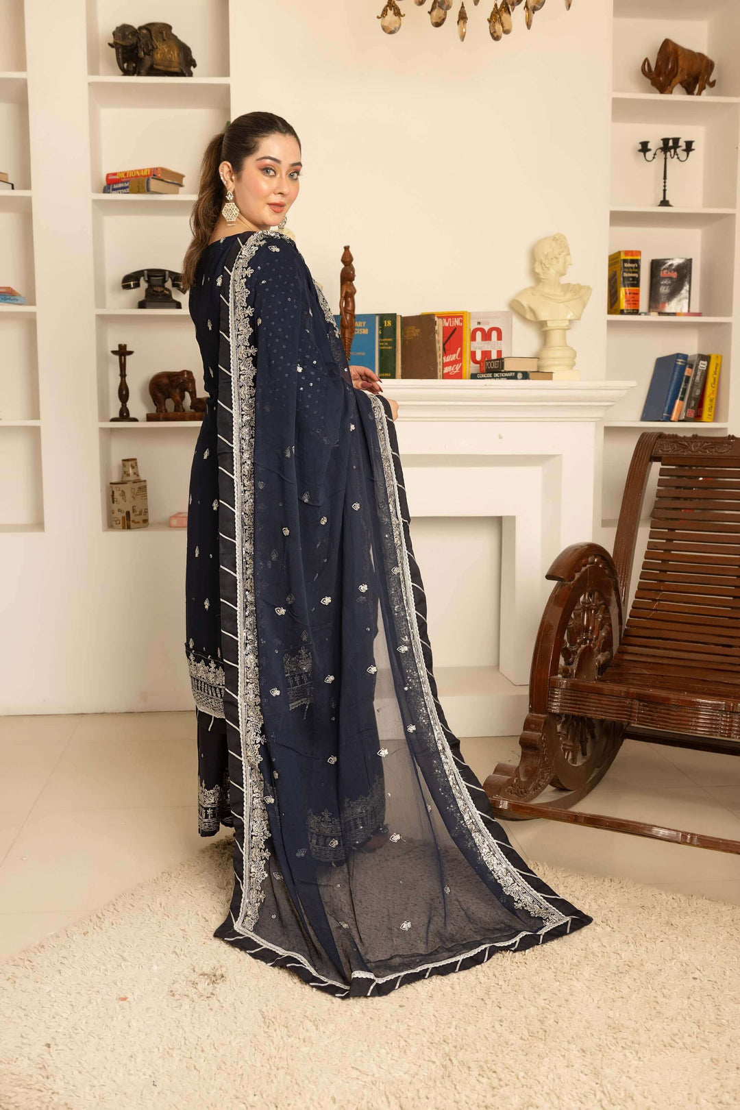 Back design of navy blue lehenga and kameez with embroidery and handwork