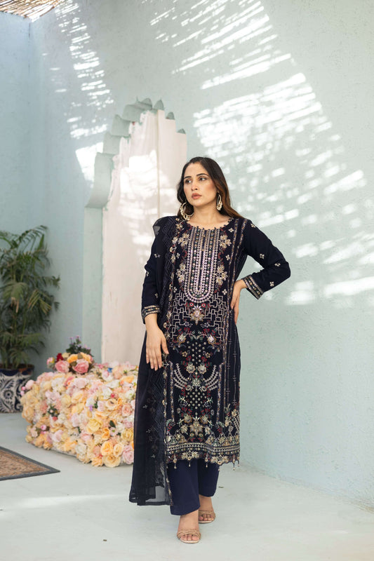 Woman in a dark blue chiffon embroidered dress 