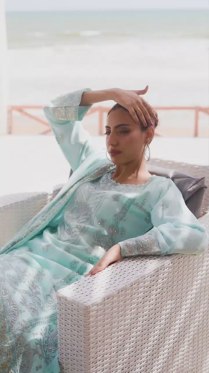 Model wearing light blue embroidered lehnga 3-piece suit, showcasing skirt movement, embroidery details, and full look transitions.