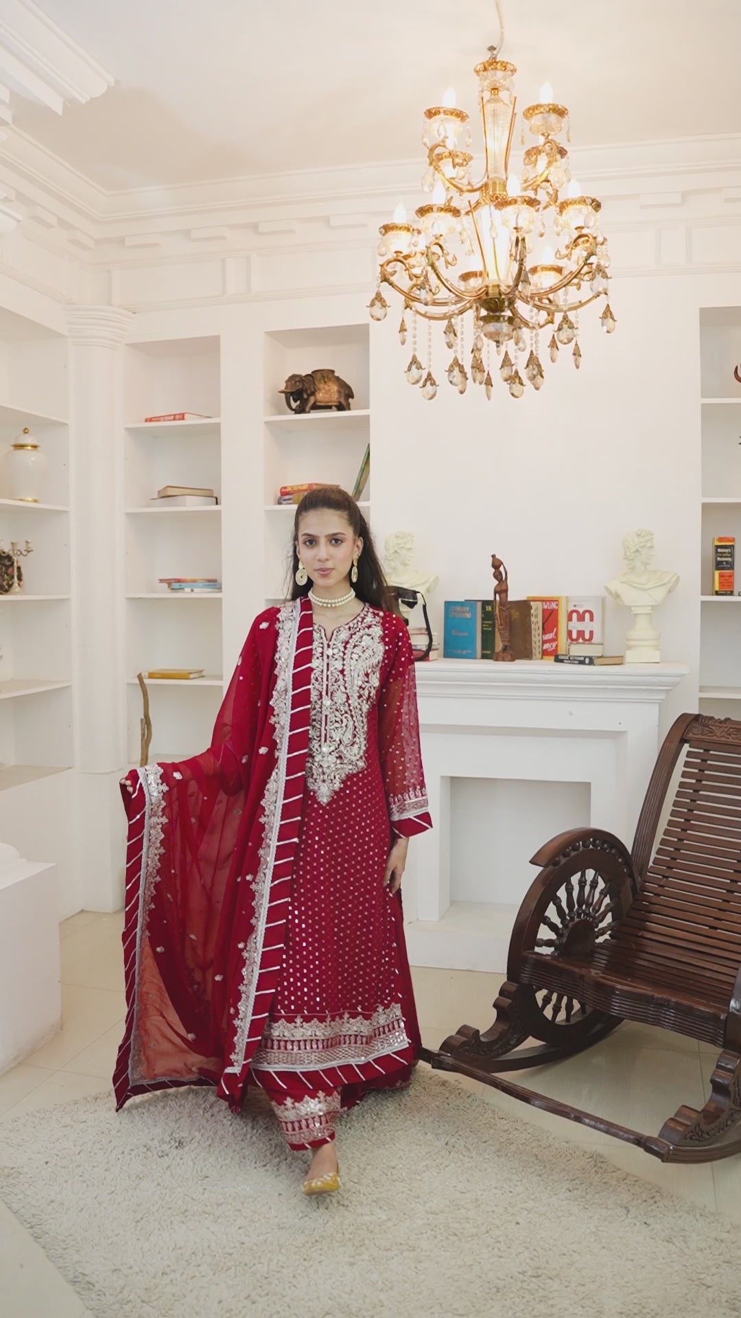 Video of model wearing red lehenga with heavy embroidery for weddings and festive events