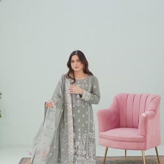 Model showcasing grey embroidered lehnga 3-piece suit with flowing skirt, detailed embroidery close-ups, and dupatta styling in motion.