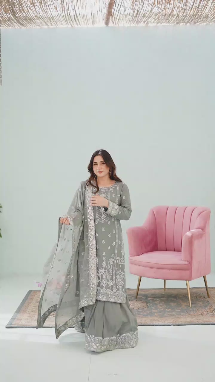 Model showcasing grey embroidered lehnga 3-piece suit with flowing skirt, detailed embroidery close-ups, and dupatta styling in motion.