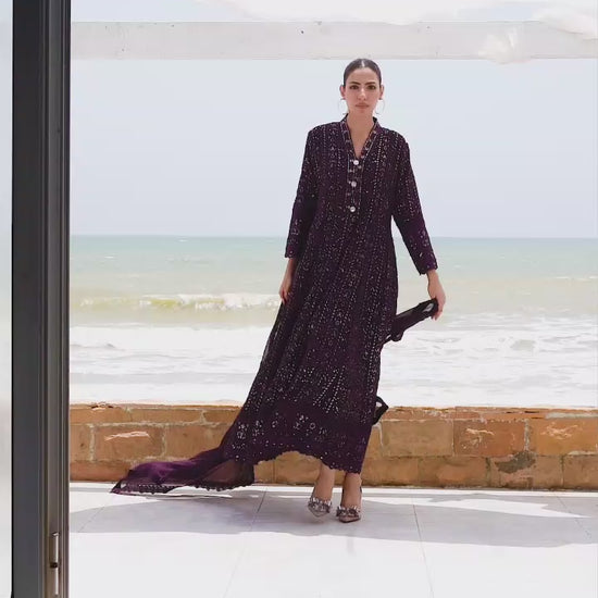 Model showcasing dark purple embroidered maxi dress with graceful twirls and close-up details of hand embroidery.
