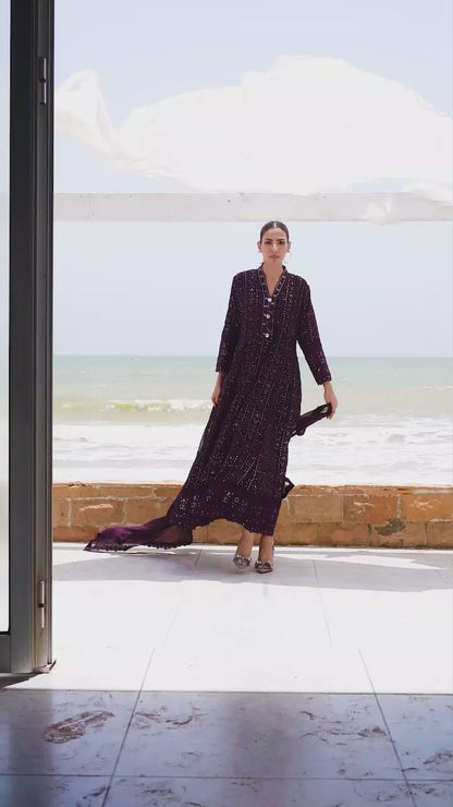 Model showcasing dark purple embroidered maxi dress with graceful twirls and close-up details of hand embroidery.