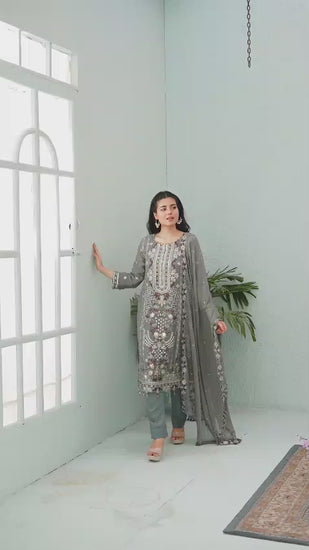 Woman in a gray embroidered chiffon shalwar kameez video