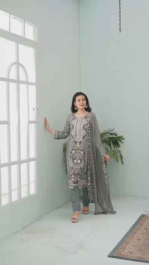 Woman in a gray embroidered chiffon shalwar kameez video