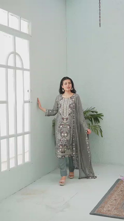 Woman in a gray embroidered chiffon shalwar kameez video